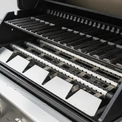 A close-up view of high-quality 304-grade stainless steel burners and sturdy cooking grates within a built-in gas grill